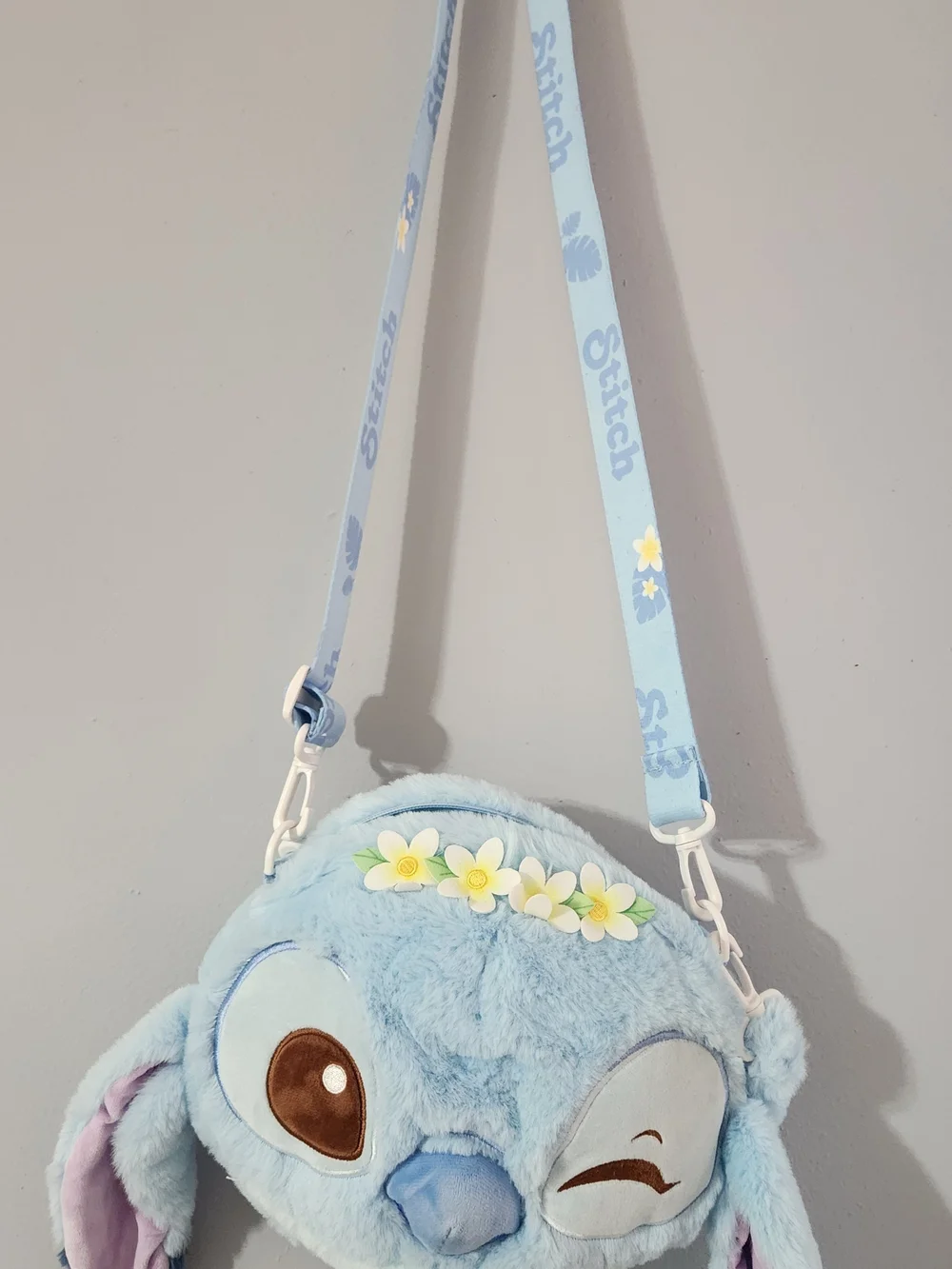 Plush Blue Stitch Face Crossbody Bag with Floral Accent